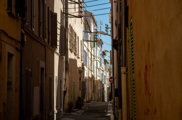 Fototapeta na wymiar Sunny day in South of France, walking in ancient Provencal coastal town La Ciotat, Provence, France
