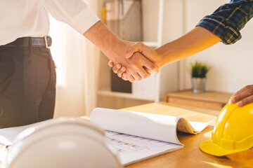 Successful team building asian young male, man or builder group handshake together at office after...