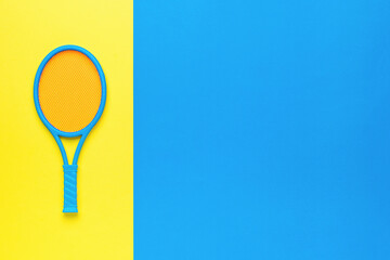 A small badminton racket on a yellow and blue background. Minimal sports concept.