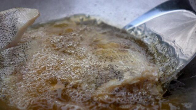 Close up hand chef fried Gourami fish