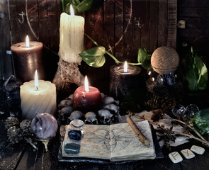Wicca, esoteric and occult still life with vintage magic objects and book on witch table altar for mystic rituals and fortune telling. Halloween and gothic concept