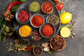 Herbs and spices in metal bowls. Food and cuisine ingredients. Colorful natural additives.