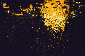 Gold bokeh from water of lights