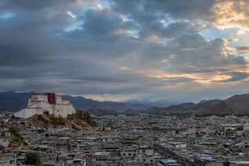 Sunrise over Shigatse with Little Potala on background, residence of Panchen Lama, Tibet - China
