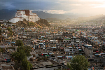 Fototapeta na wymiar Sunrise over Shigatse with Little Potala on background, residence of Panchen Lama, Tibet - China
