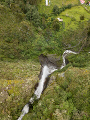 Aerial view of a waterfall in the Peruvian Andes. Fresh water source from high mountain.