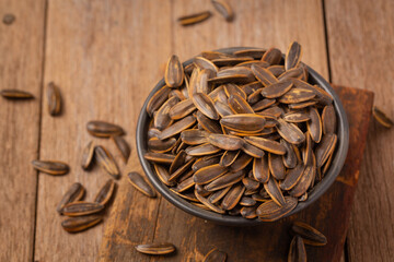 sunflower seeds in a plate on a gray background