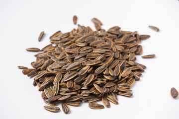 sunflower seeds in a plate on a gray background