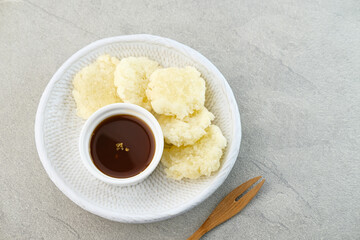 Cireng, a savory snack from West Java, Indonesia, made from tapioca flour and deep-fried, served with a spicy sauce.

