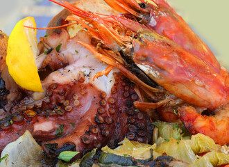 restaurant fish dish with grilled octopus on a large lobster