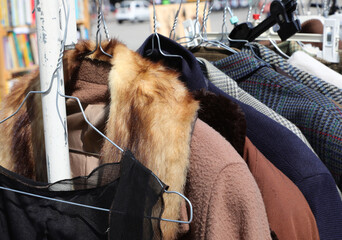 clearance sale of vintage style dresses and furs for sale in the flea market