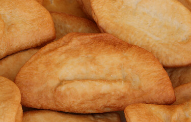 fried panzerotti which are like sandwiches stuffed with mozzarella and tomato and then cooked in boiling oil typical Italian dish with very high caloric content
