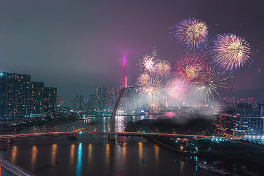 Celebration. Landmark 81 skyscraper with fireworks light up sky over business district in Ho Chi Minh City ( Saigon ), Vietnam. New Thu Thiem bridge in night view.  Holidays, celebrating New Year