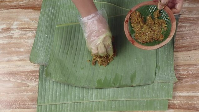 Stirring the betutu chicken seasoning. Balinese Spiced Chicken