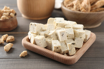Natural tofu on wooden table, closeup. Soy product