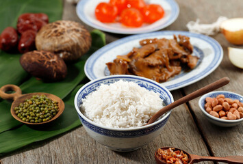 Rice and Sticky Rice with Pork Chicken Meat Soy Sauce Stir Fry, Mushroom, Peanuts, and Salted Egg Yolk. Ingredient Making Bak Chang or Zongzi for Duanwu Dragon Boat Festival