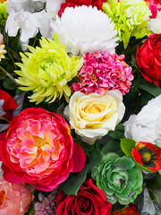 Beautiful artificial flowers as a background.