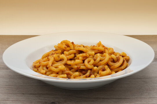 Italian Gramigna Pasta. Gramigna with bolognese rag&ugrave;. Traditional Italian food