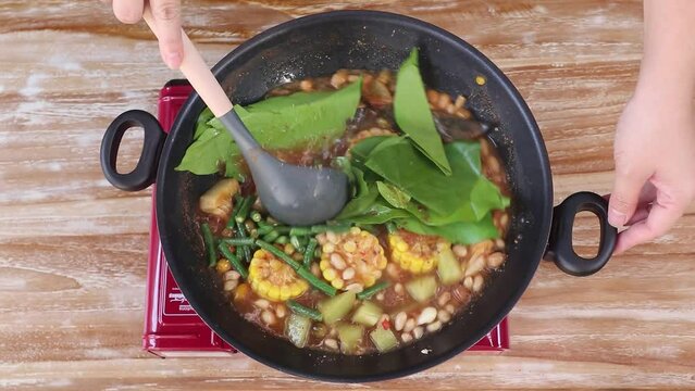Cooking tamarind vegetables in Indonesian is called Sayur Asam Jawa.