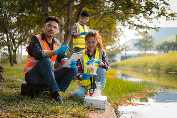 Scientists team collect water samples for analysis and research on water quality, environment with...