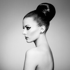 Black and white fashion art studio portrait of beautiful elegant woman.  Elegant ballet style. Hair...