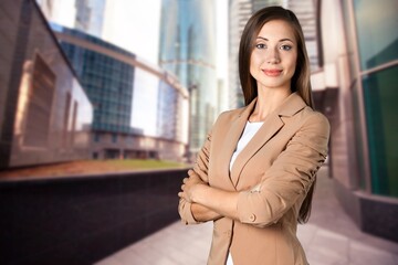 Business woman standing on the street of a city.