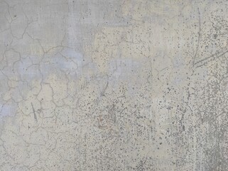 Wall fragment with scratches and cracks.Grunge Grey wall with peeling paint,close-up background photo texture.Old distressed wall backdrop, grunge background or texture.Old wall background.Background.