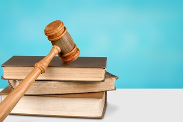 Judge gavel on law books in court, law and justice concept.