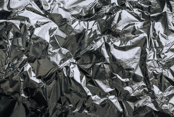 Background, texture of silver foil, colored paper. Photo, top view, copy space.