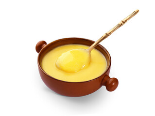 Ghee, Clarified butter bowl with spoon on a white background
