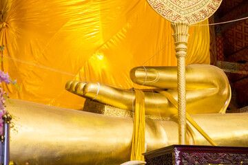 Close up of Big hand of Golden Buddha statue temple in Thailand