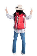 Rear view of Asian woman with hat and backpack standing and pointing something