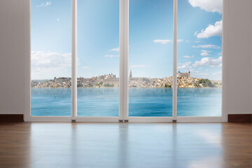 Fototapeta na wymiar Large window with a view of the lake and cityscapes