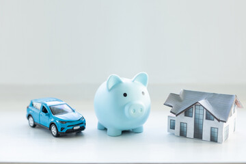 Piggy bank financial savings for house and car. Buying and renting real estate and transport...
