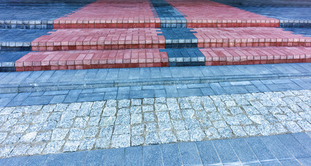 Stairs and paving made of colored paving, front view