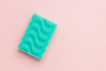 green sponge and foam on pink background