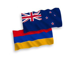 National vector fabric wave flags of New Zealand and Armenia isolated on white background. 1 to 2 proportion.
