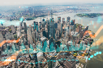 Aerial panoramic helicopter city view, Lower Manhattan, Downtown, New York, USA. World Trade Center, bridges. Forex candlestick graph hologram. The concept of internet trading, brokerage, analysis