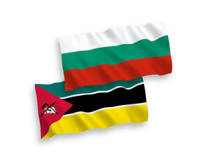 National vector fabric wave flags of Bulgaria and Republic of Mozambique isolated on white background. 1 to 2 proportion.