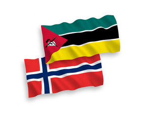 National vector fabric wave flags of Norway and Republic of Mozambique isolated on white background. 1 to 2 proportion.