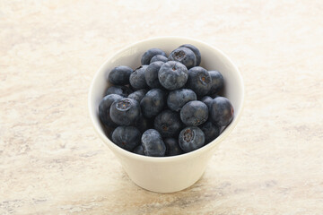 Sweet ripe blueberry heap in the bowl