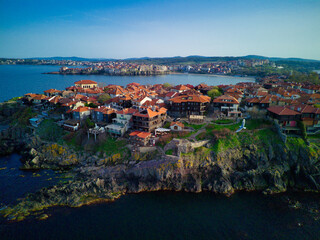 Fototapeta premium iew from a height of the city of Nessebar with houses and parks washed by the Black Sea in Bulgaria