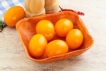 Sweet ripe yellow tomato in the bowl