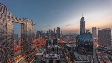 Futuristic Dubai Downtown and finansial district skyline aerial night to day timelapse.