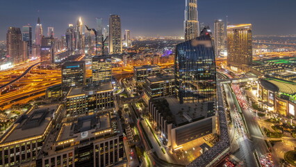 Futuristic Dubai Downtown and finansial district skyline aerial day to night timelapse.