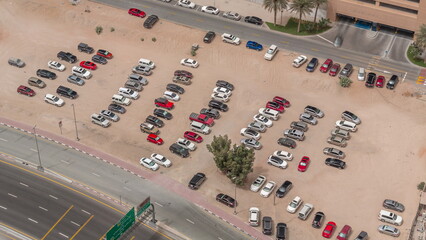 Car parking lot viewed from above timelapse, Aerial view.