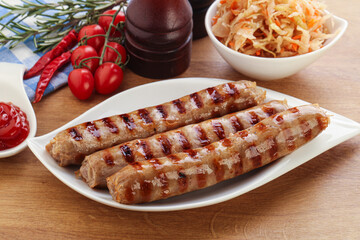 Grilled sausages with cabbage and sauce