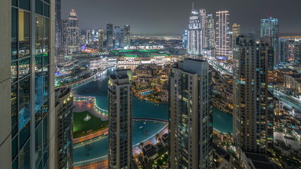 Aerial panoramic view of a big futuristic city night timelapse. Business bay and Downtown
