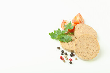 Liverwurst slices, tomato, pepper and parsley  on white background