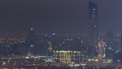 Buildings around Deira and creek district in Dubai night timelapse. Dubai, UAE.